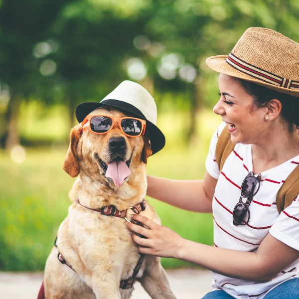 woman smiling at her funny dog